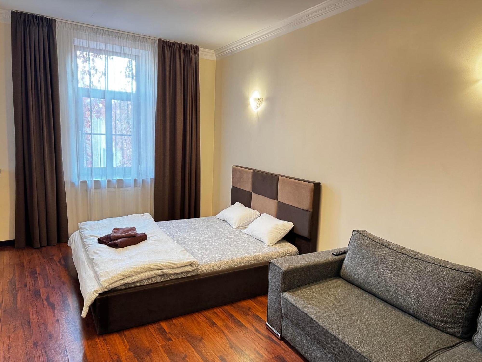 Aparthotel Riga Eksteriør bilde A bedroom in a hotel